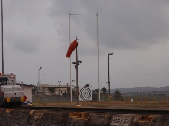 The target is for the line handlers that walk the walls of the Canal. They practice throwing there monkey balls at the target and over the top pole. 