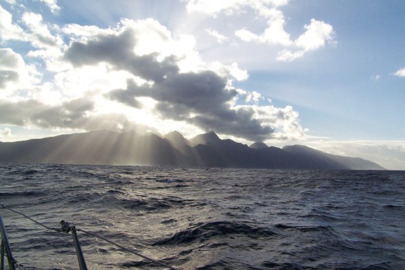 As the sun rose over South Tahiti it shined over the mountains that rise 4500 feet above sea level and the sunlight warmed my face as we searched the reef breakers for our narrow passage into the anchorage as Adam slept below.  It was a cold night became its winter here, almost 75 degrees last night!