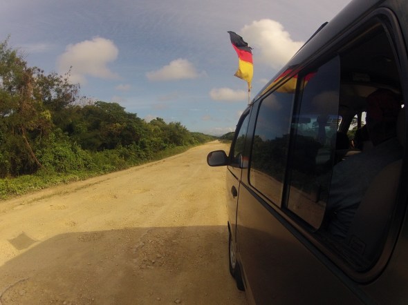 On our way to the Millennium Caves. We had to drive on the old WWII airstrip that lead to the village that starts the cave trip. 